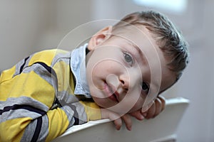 Portrait of kid at highchair