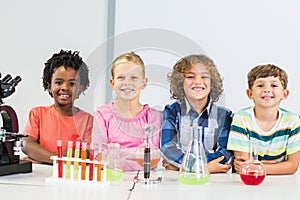 Portrait of kids doing a chemical experiment in laboratory