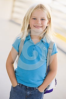 Portrait of kindergarten girl with backpack