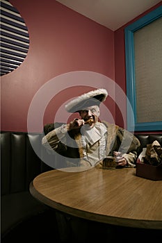 Portrait of King Henry VIII eating lunch in cafe