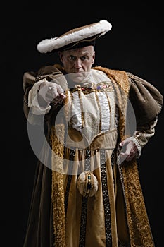 Portrait of King Henry VIII in historical costume pointing