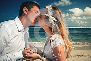 Portrait of kissing couple at beach. Traveling at Thailand