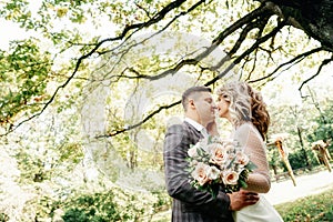 Portrait of kissing couple in the garden