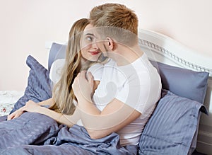 Portrait kissing Happy couple bed bedroom in the morning, happy family, healthy sleep concept