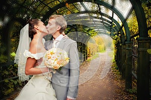 Portrait of kissing newlyweds