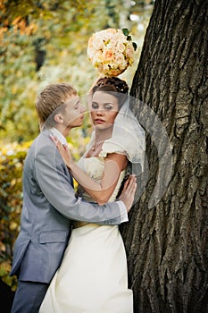 Portrait of kissing newlyweds