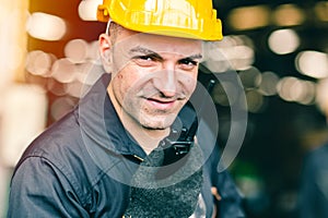 Portrait of labor worker engineer hand holding radio for talking communication with coworker in industrial factory and waring
