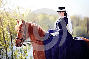 Portrait of the lady on a red horse.