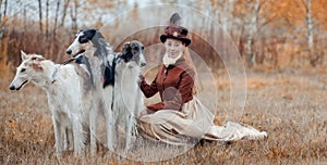 Portrait of Lady with russian borzoy dogs photo