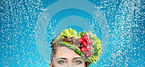 Portrait of a lady with vegetables on head