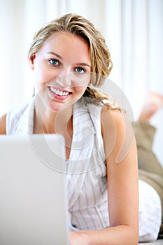 Portrait, laptop and smile of woman in home on floor for networking, typing email and relax. Computer, happy face and