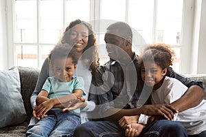 Portrait large African American family sitting together