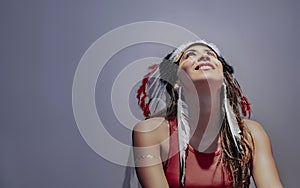 Portrait of a latin model with a feathered headdress fifth