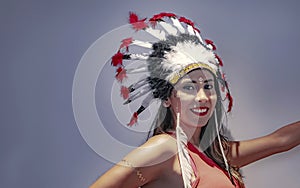 Portrait of a latin model with a feathered headdress third