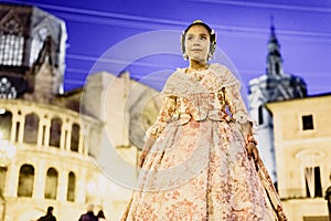 Portrait of a latina fallera girl wearing the traditional valencian costume of Fallas photo