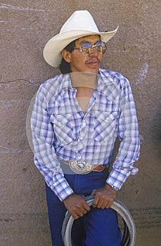 Portrait of Latino cowboy with lasso, Inter-tribal ceremonial Indian rodeo, Gallup NM