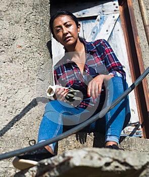 Portrait of latino woman on the porch of a house