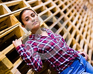 Portrait of latino woman standing in warehouse
