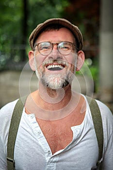 Portrait of laughing bearded man in his 50s