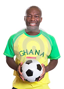 Portrait of a laughing football fan from Ghana wit