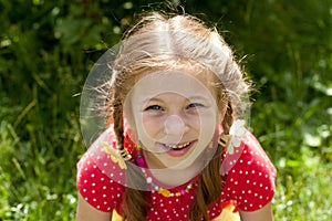 Portrait of laughing girl with pigtails