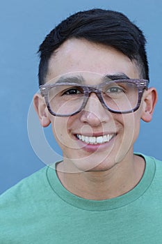 Portrait of a laughing hispanic guy with glasses - Stock image