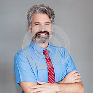 Portrait of laughing mature businessman with beard