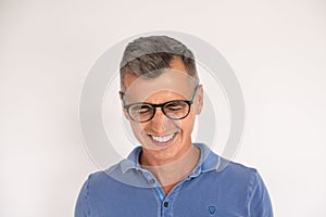 Portrait of laughing mature man wearing glasses