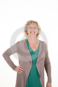 Portrait of laughing senior woman casual against white background