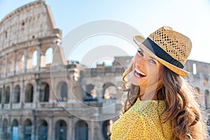 Portrait of laughing woman at Colosseum in Rome in summer