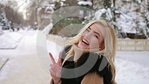 Portrait of laughing young girl in Park in winter.