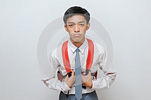 Portrait of lazy Asian high school student with uniform