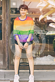 Portrait LGBT transgender shemale or women short hair happy smile Asian race with rainbow shirt photo