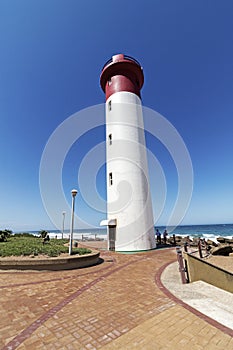 Portrait Lighthouse on Paved Beachfront Promenade