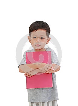 Portrait of little Asian baby boy age about 3 years old hugging a book on white isolated background with clipping path. Education