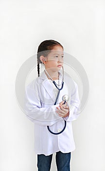 Portrait little asian kid girl with stethoscope while wearing doctor`s uniform isolated over white background