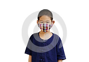 Portrait little asian one boy wearing fabric face mask for hygiene protect or prevention from virus, bacteria, germs and air