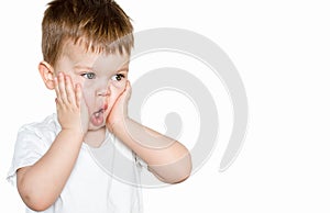 Portrait of a little baby boy with sad scared frightened shocked feared emotion, holding hands on his cheeks isolated on white