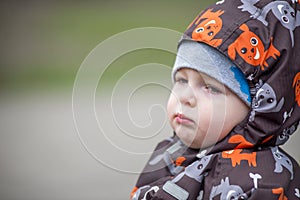 Portrait of a little baby with a serious facial expression