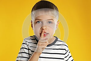 Portrait of little boy on background