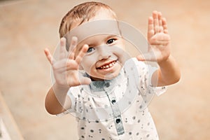 Portrait of a little boy blond laughing