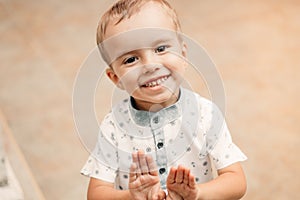 Portrait of a little boy blond laughing photo