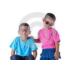 Portrait of little boy and girl is colorful T-shirt with glasses isolated on white background