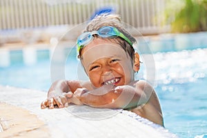 Portrait of little boy having fun in swimming pool