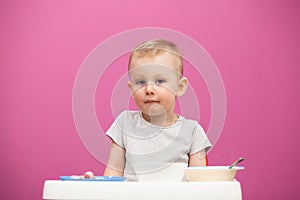 Portrait of the little boy. Little boy does not want to eat Mashed potatoes