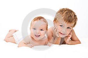 Portrait of little boy with newborn sister