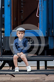Portrait of a little boy in a old steam train