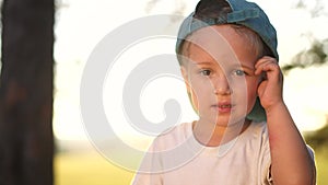 portrait of a little boy in the park. close-up of a boy in nature. happy family child concept. happy boy smiling