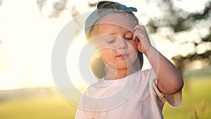 Portrait of a little boy in the park. Close-up of a boy in nature. Happy family child concept. Happy boy smiling