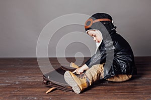 Portrait of a beautiful little boy in a plane pilot costume